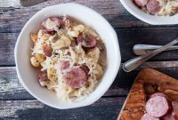 Hearty German Sausage and Sauerkraut Skillet with Dumplings