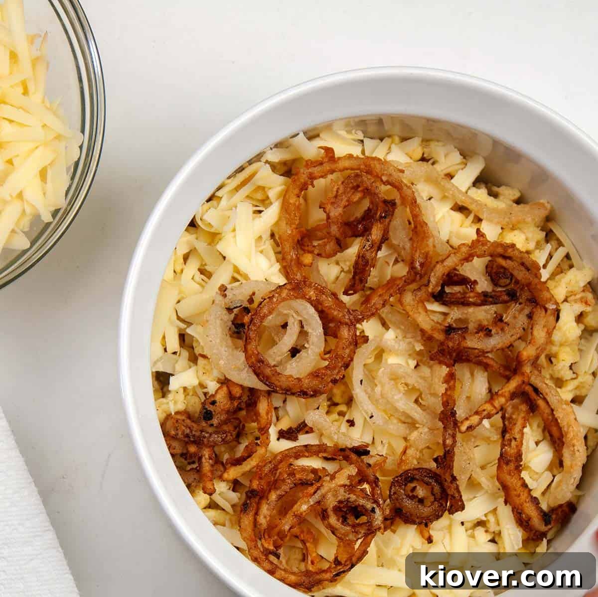 Hearty German Cheese Spaetzle 5 Layering ingredients into dish prior to baking.