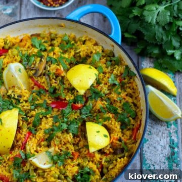 Close-up of the delicious Plant-Based Paella in a pan, highlighting the fresh ingredients.