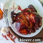 Fireball Whisky BBQ coated Grilled Chicken on a white plate.