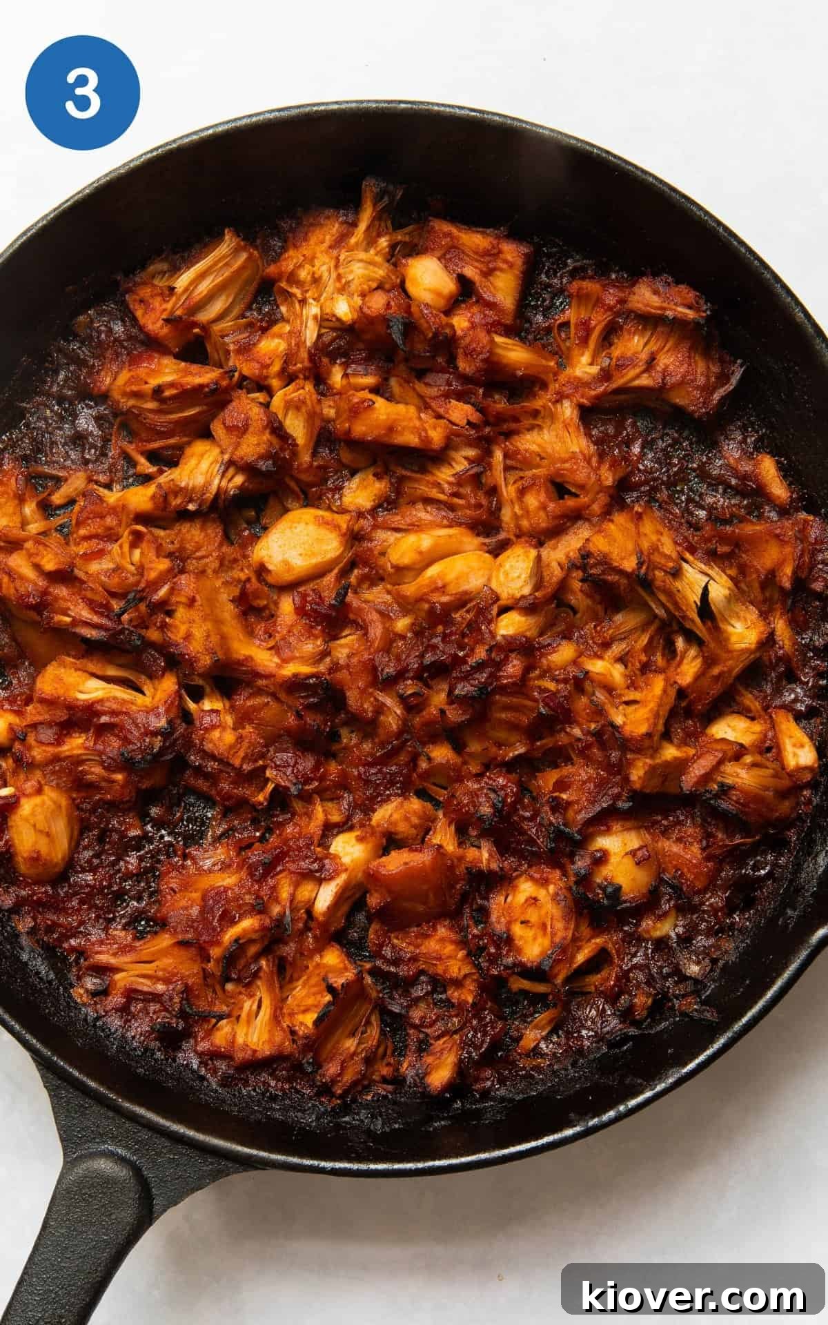 Ingredients for vegan jackfruit gyros cooking in a pan.