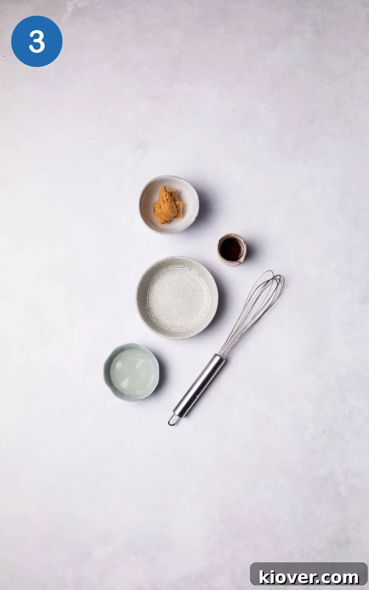 Ingredients for the miso and maple sauce combined in a small bowl.