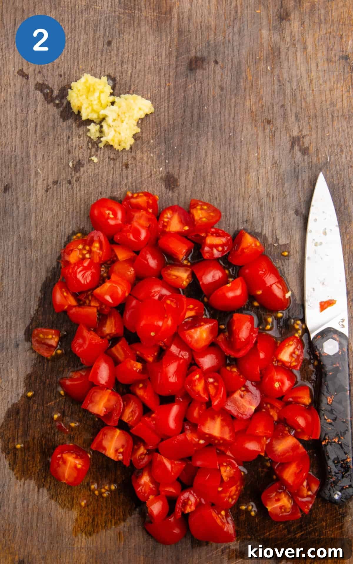 Cherry tomatoes quartered and garlic cloves crushed, ready for the sauce.