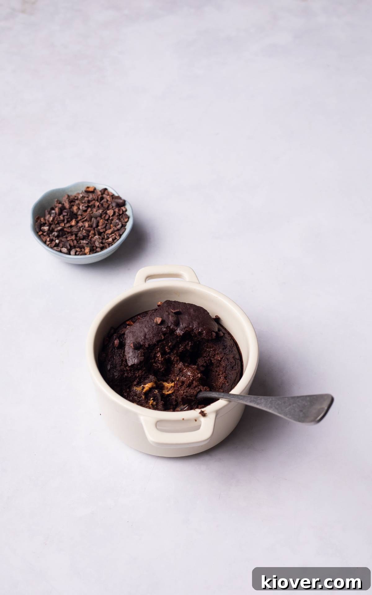 Gluten-Free lava cake dessert in a ramekin, showcasing its rich, dark chocolate color and smooth texture.