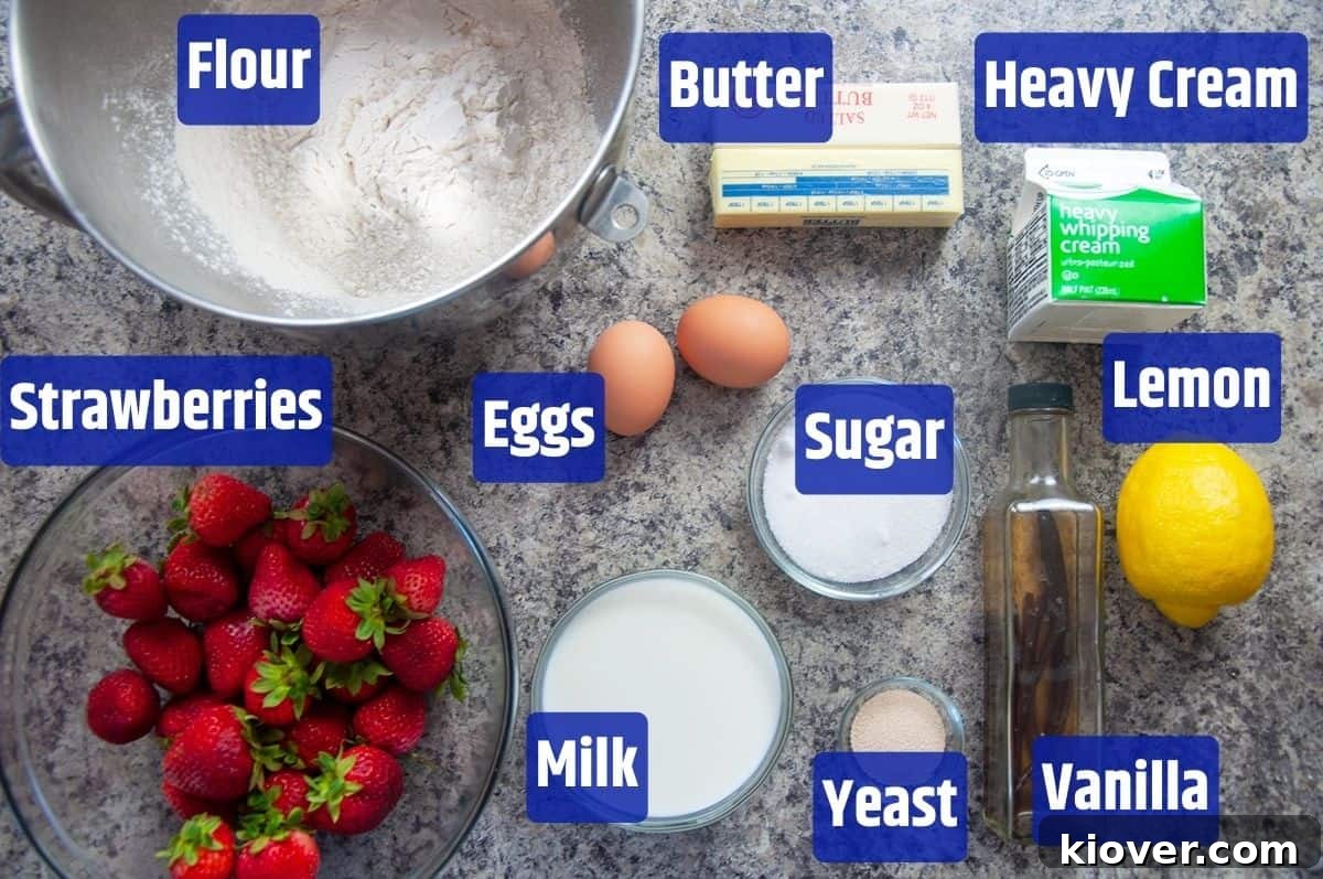 Dampfnudel Ingredients A vibrant display of fresh ingredients for German Dampfnudel, including flour, ripe strawberries, milk, cream, eggs, yeast, vanilla extract, lemon, and rich butter.