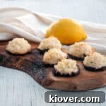 German Kokosmakronen Coconut Macaroons on a wood platter.