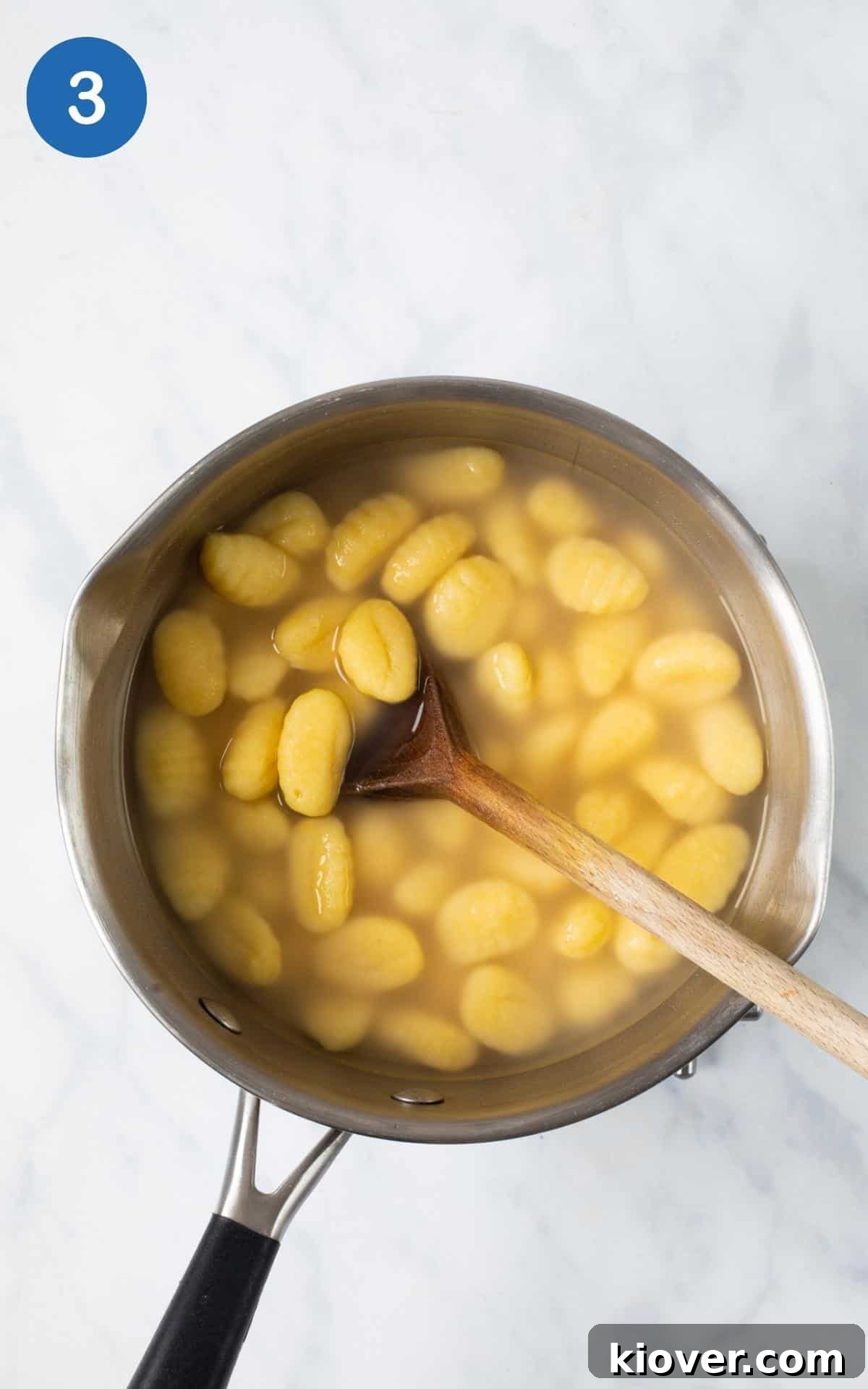 Hearty Sausage and Gnocchi Bake 6 silver pot with boiling water and gnocchi.