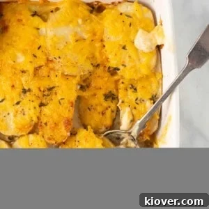 vegan dauphinoise potatoes in baking dish with spoon
