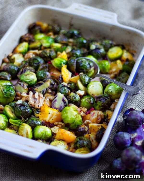Delicious roasted Brussels sprouts with oranges and walnuts, front view, beautifully arranged and ready to serve for a festive meal.
