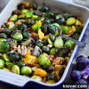 Roasted Brussels sprouts with oranges and walnuts, a perfect festive side dish, close-up view.