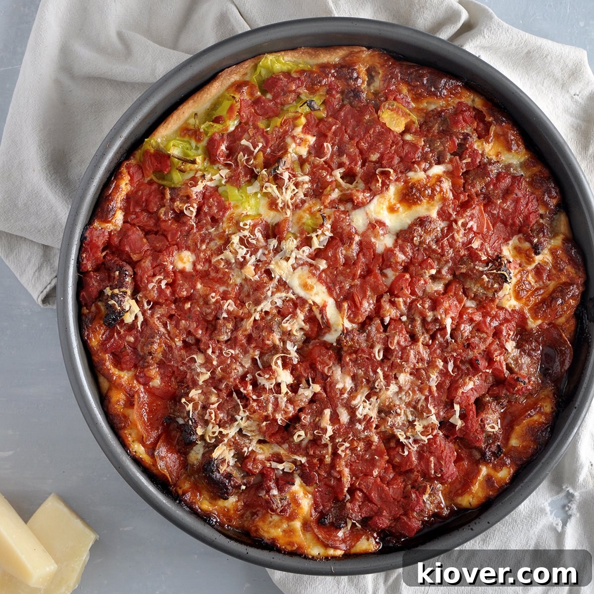 Meat Lovers Chicago Deep Dish Pizza from the top, showcasing a rich, cheesy, and meaty filling with a golden-brown crust.