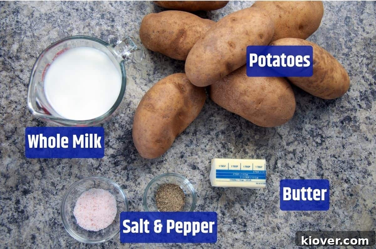 Key ingredients laid out for mashed potatoes: russet potatoes, whole milk, butter, salt, and black pepper.
