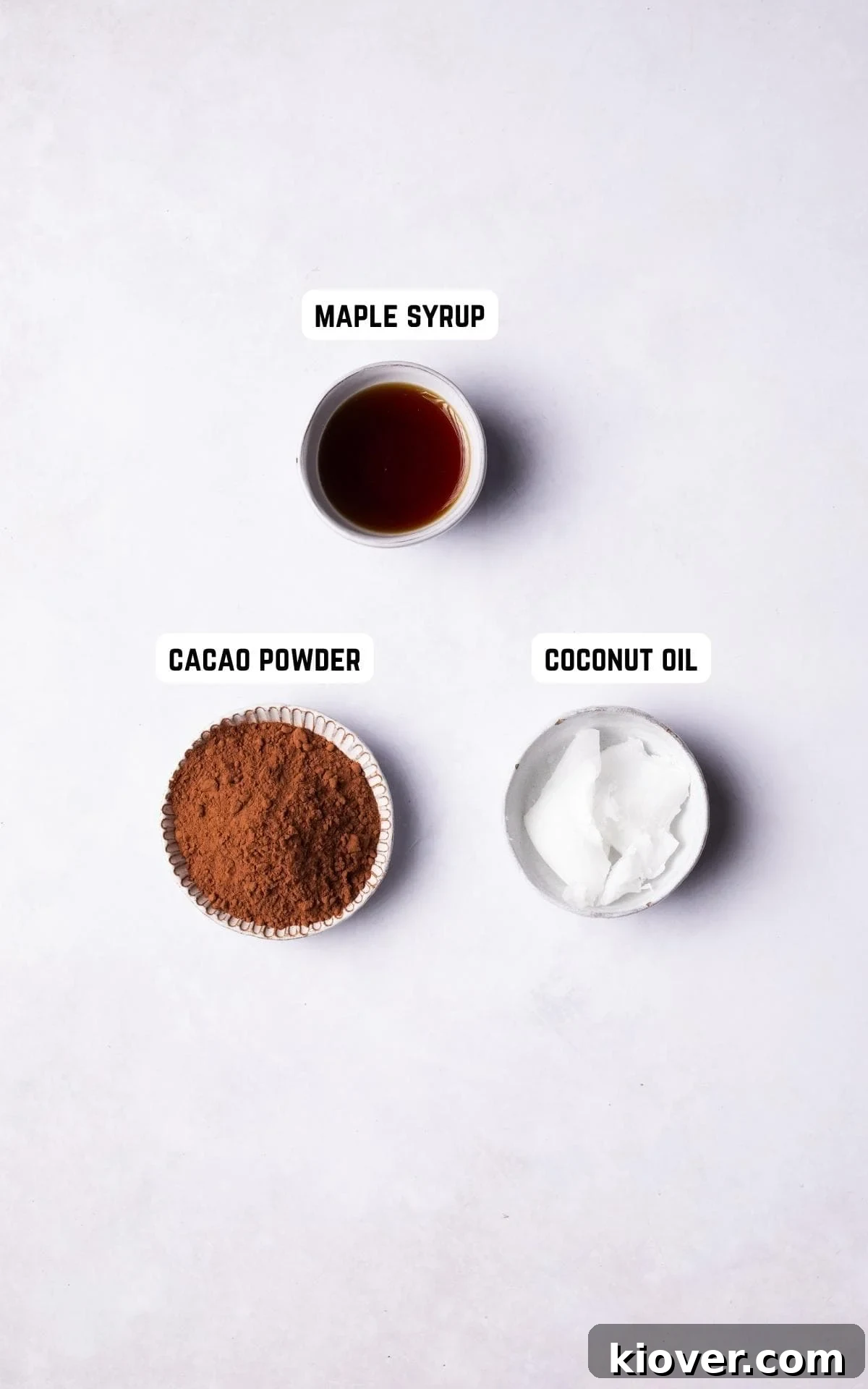 Decadent Vegan Chocolate Truffles 3 Individual ingredients for Vegan Chocolate Truffles laid out: coconut oil, cacao powder, and maple syrup.
