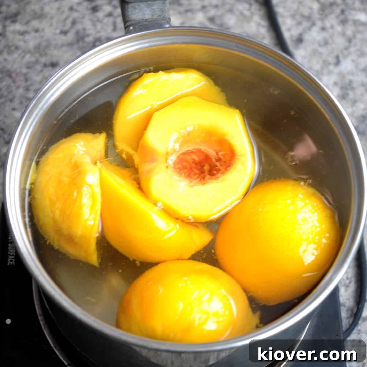 Peaches boiling in a pot.