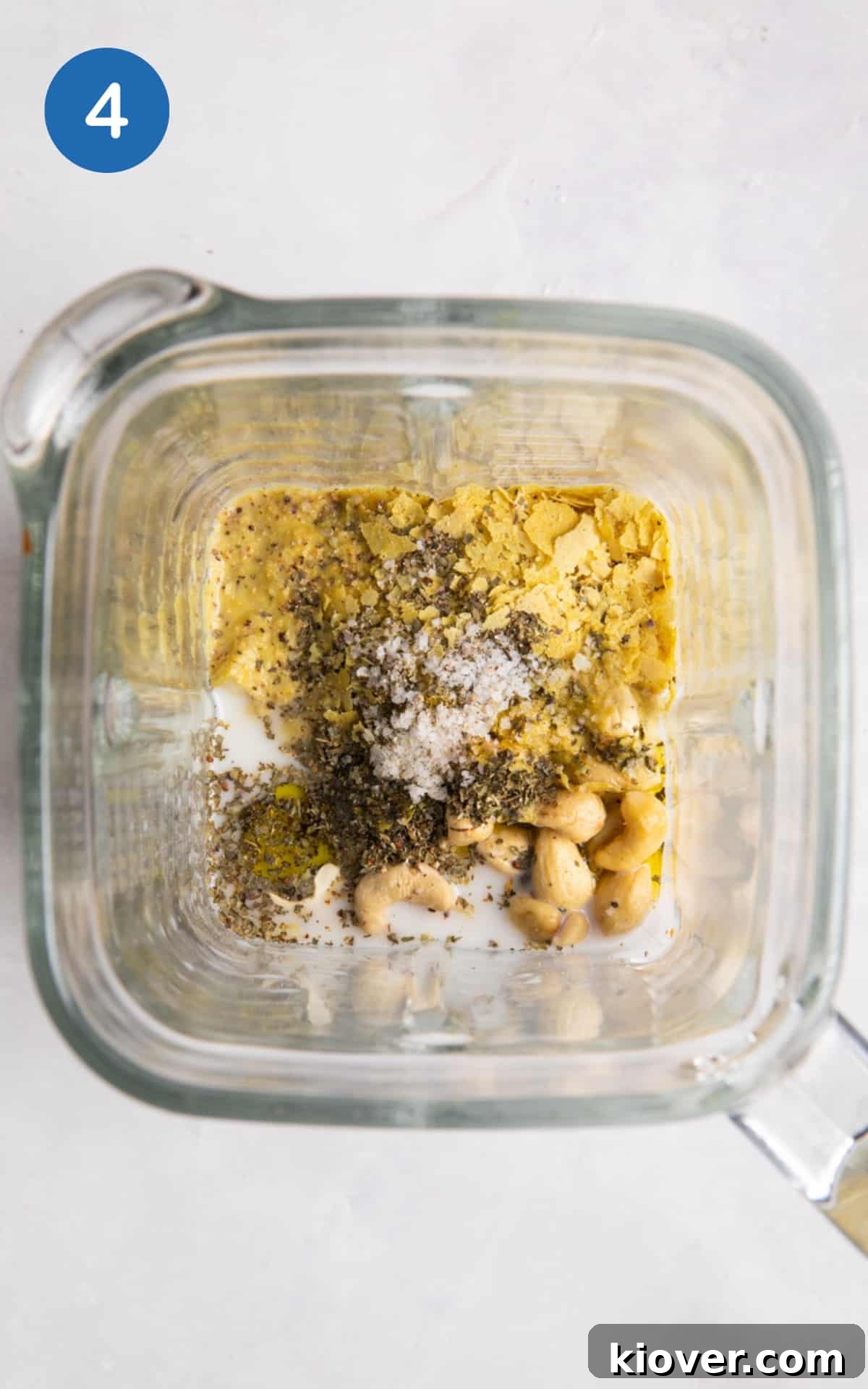 Plant-Based Lasagne Perfection 7 All the creamy ingredients for the vegan béchamel sauce, including cashews and plant milk, inside a blender ready to be processed.