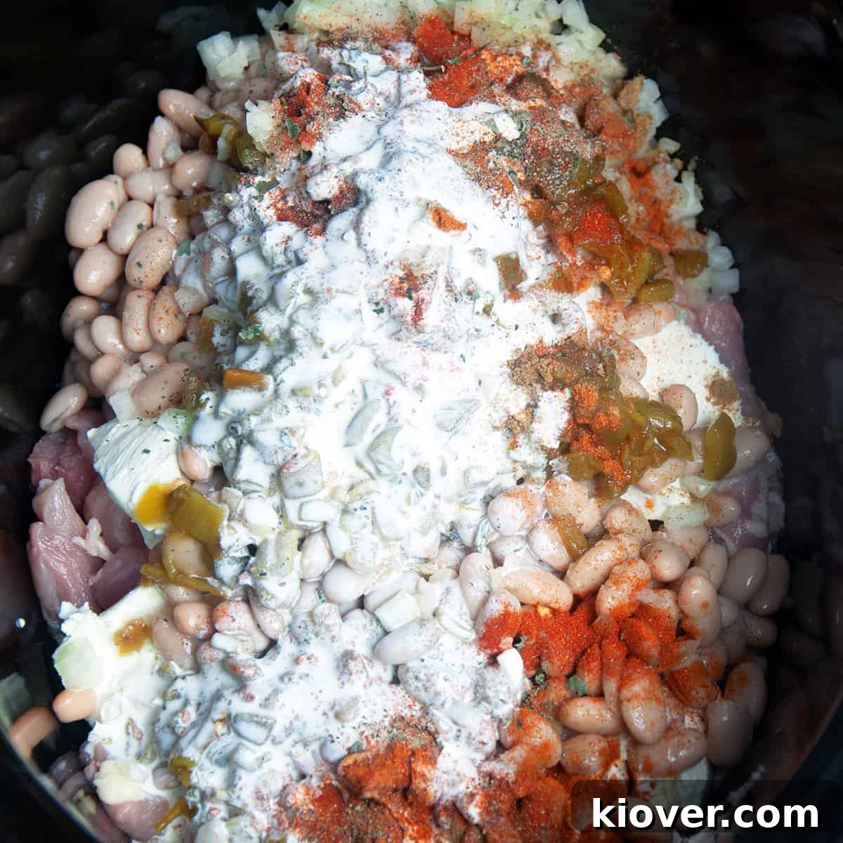 Ingredients White chicken chili ingredients in a crockpot.