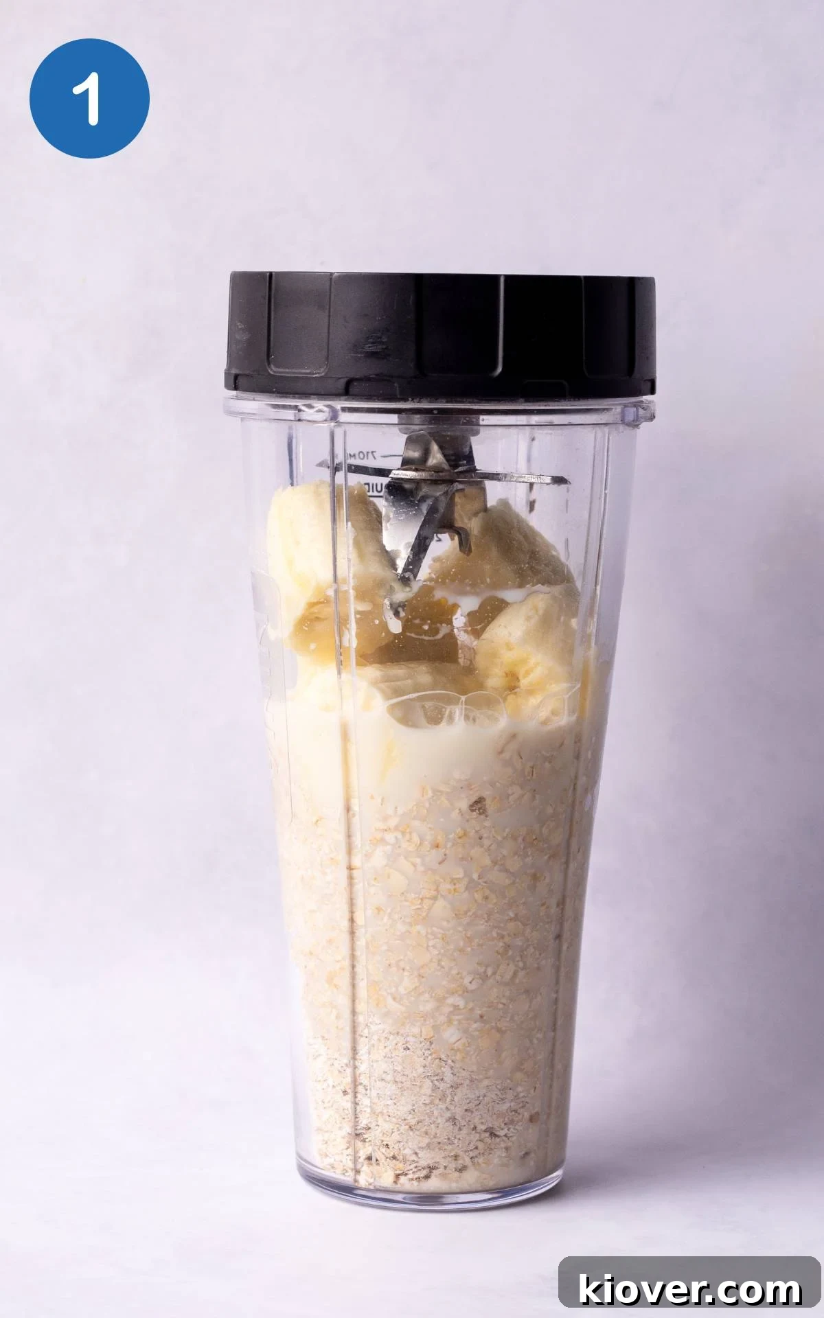 Oats, banana, and milk blended together in a blender.