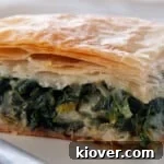 Spanakopita on a white plate.