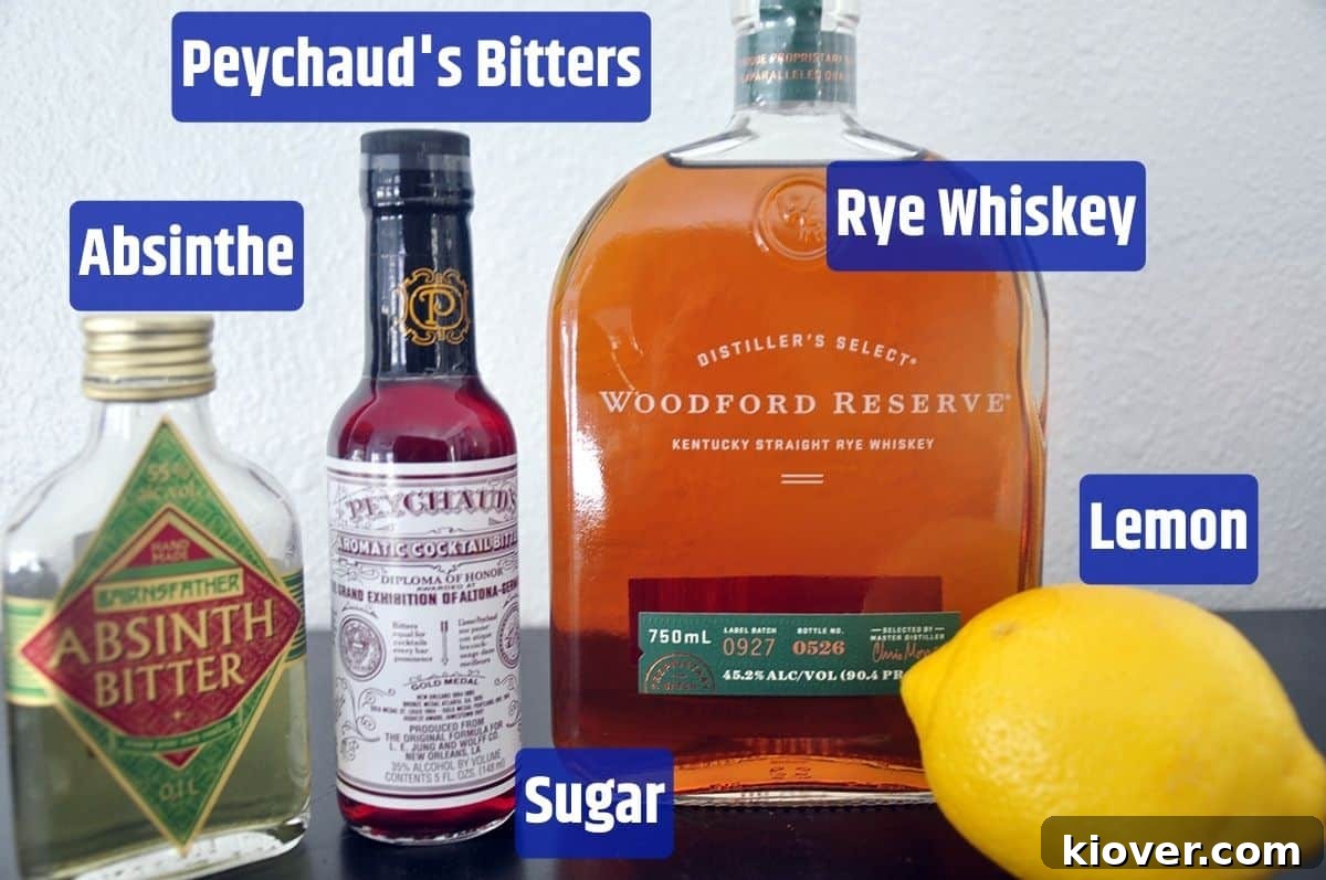 Individual ingredients for a Sazerac cocktail including Absinthe, Peychaud’s Bitters, Sugar, Rye Whiskey, and Lemon Rind.