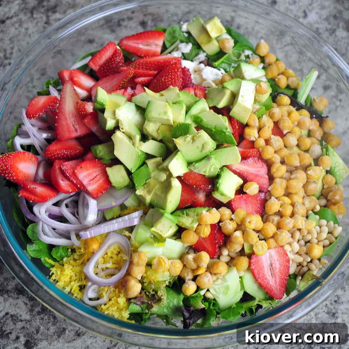 Vibrant Strawberry Salad with Zesty Vinaigrette 3 Colorful bowl of lettuce and salad ingredients.