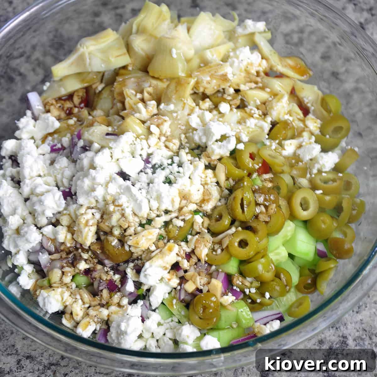 Orzo Salad Mix-ins Mixing orzo pasta with various salad ingredients.
