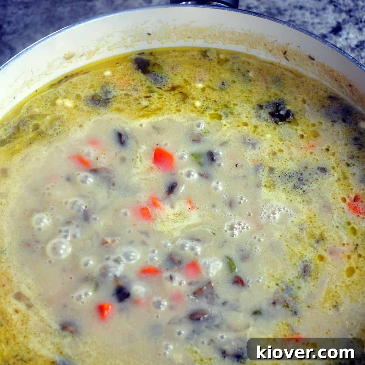 Thicken Sauce Close up of fricassee sauce thickening in a pan after chicken has been removed.