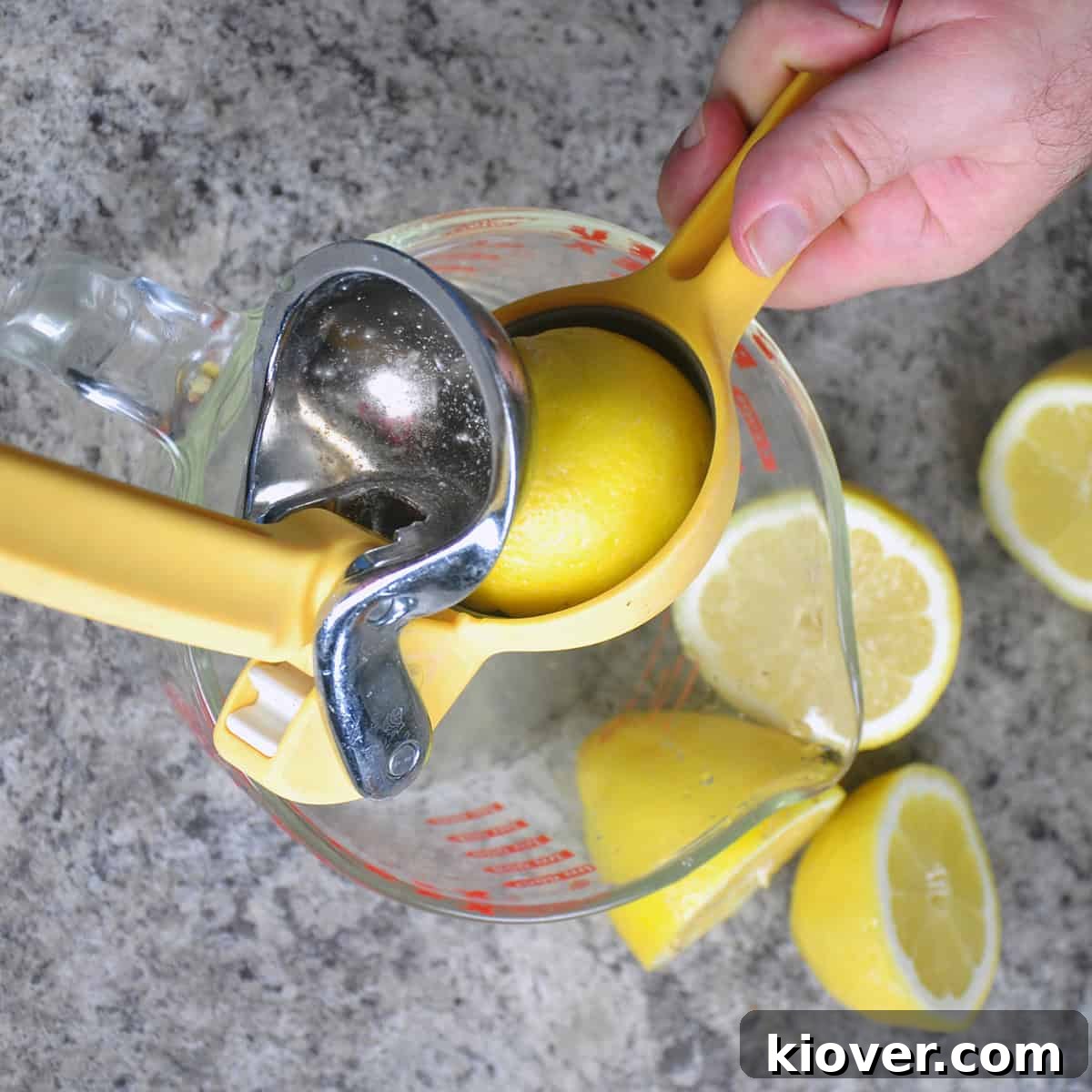 Zesty 3 Ingredient Honey Lemonade Naturally Sweetened 3 Juicing a lemon into a dish.
