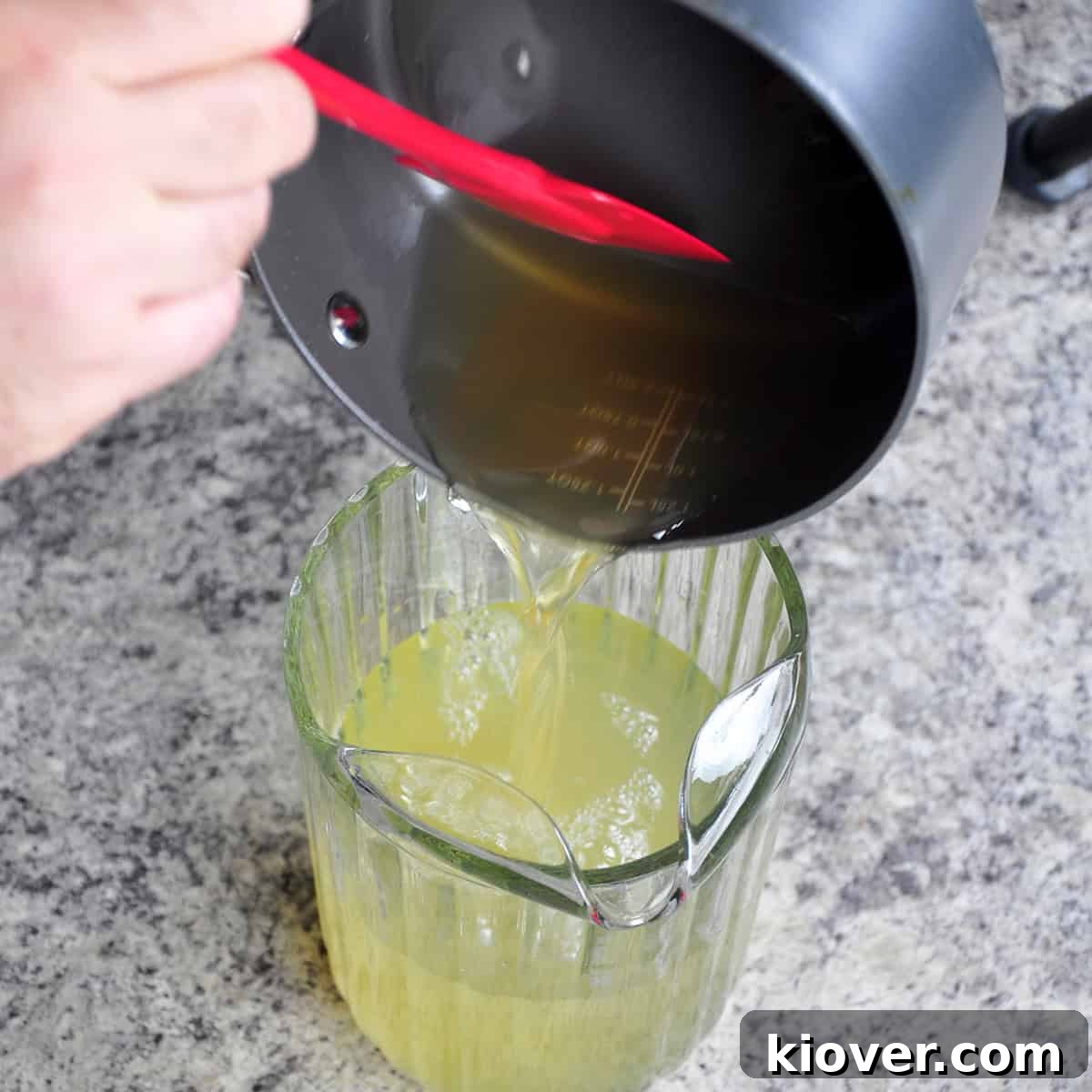 Zesty 3 Ingredient Honey Lemonade Naturally Sweetened 4 Pouring honey into a picture of lemonade.
