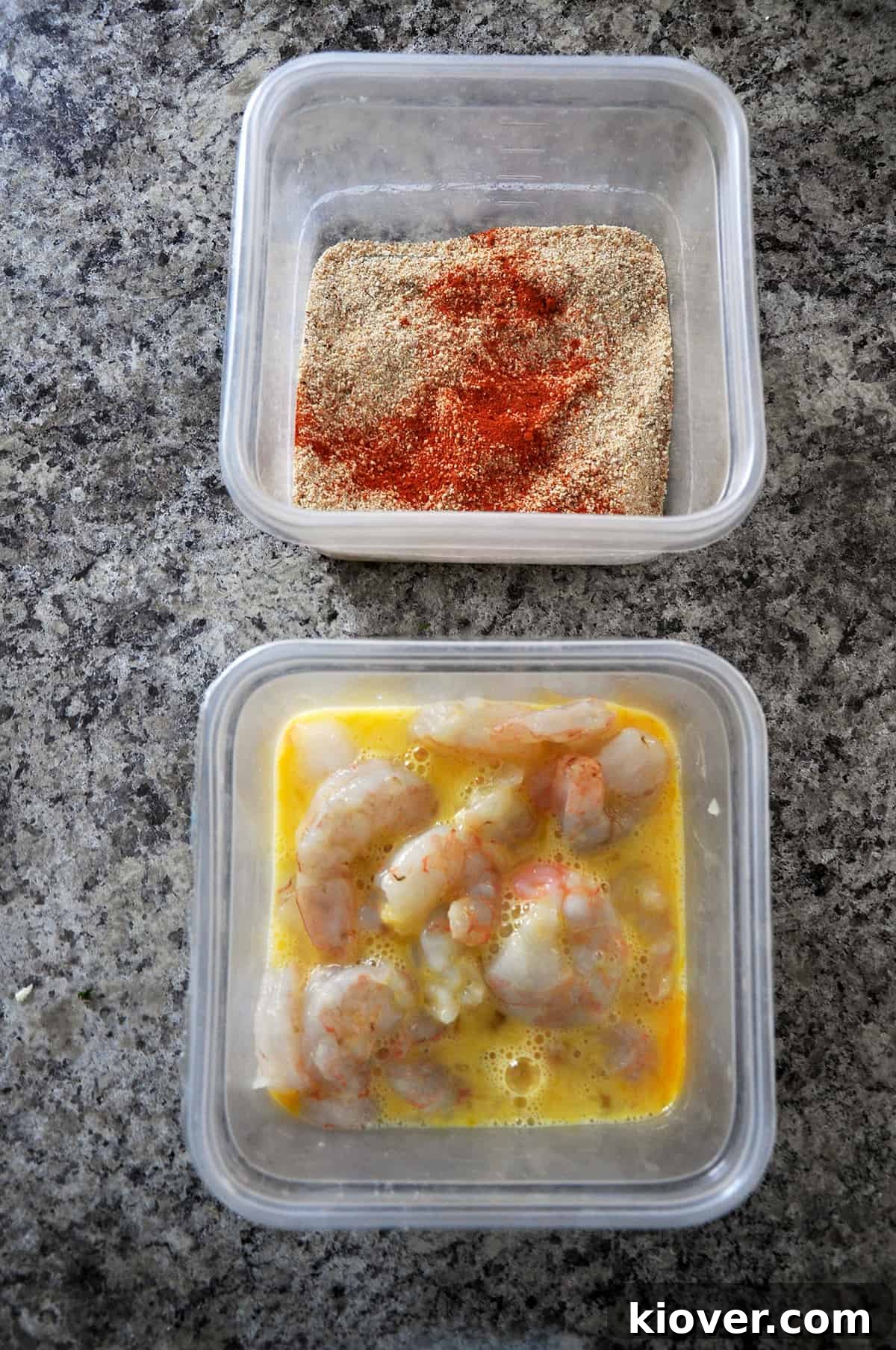 Raw Shrimp Raw shrimp being coated in an egg mixture, with a bowl of breadcrumb coating nearby, set up as a dredging station.