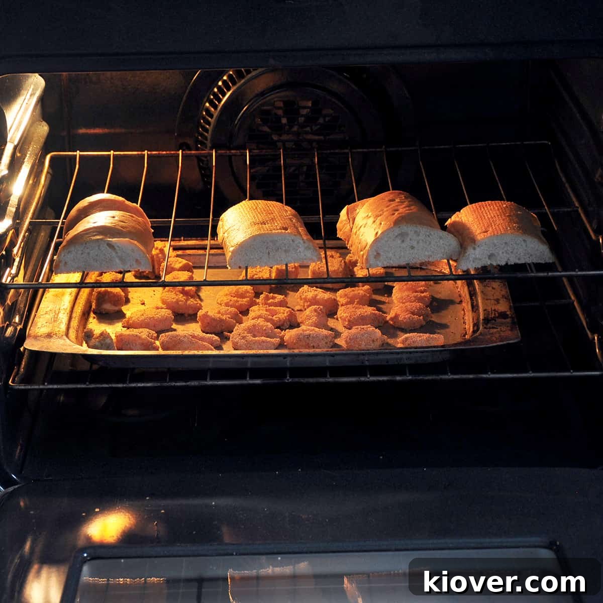 Baking Shrimp Shrimp and French bread baking together in the oven, achieving a perfect golden crispness.
