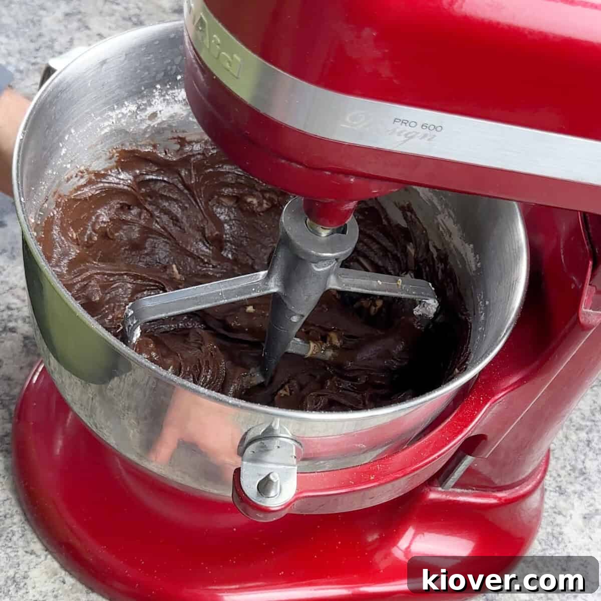 KitchenAid mixer with the Velveeta fudge ingredients combined and smooth.