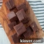 Several pieces of Velveeta fudge on a cutting board.