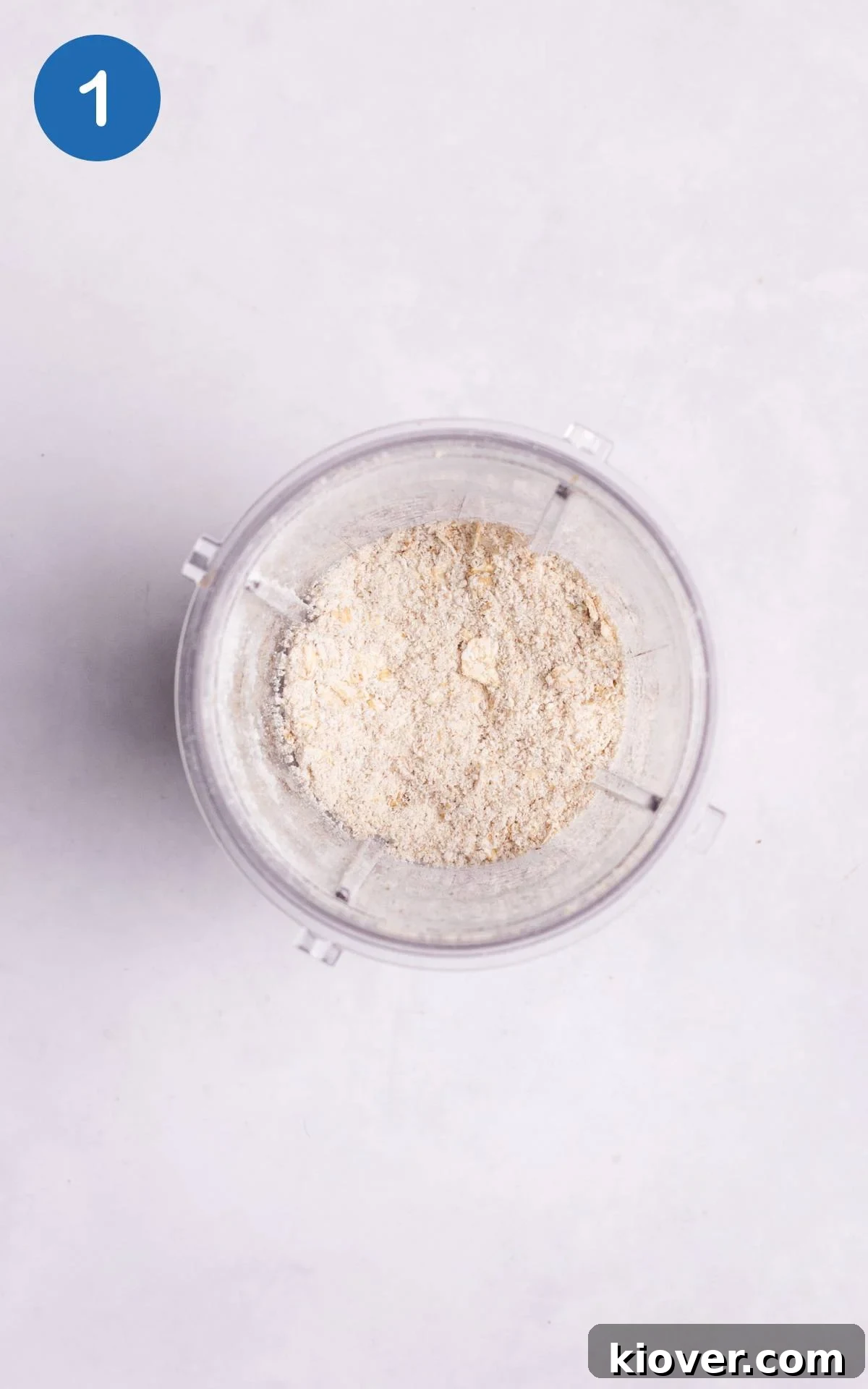 Blended oats forming flour in a blender.
