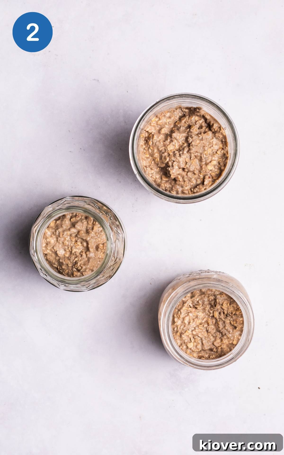 Power-Packed Protein Overnight Oats 5 mixture for protein overnight oats in three glass jars.