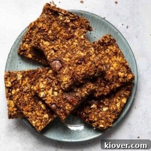 Stacked slices of 5-ingredient chocolate flapjacks on a blue plate.