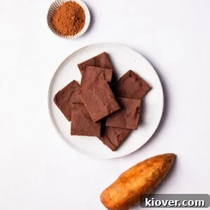 Decadent sweet potato brownies, perfectly sliced into cubes and arranged on a plate.