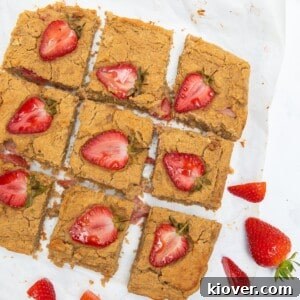 Peanut Butter Blondies with strawberries on top.