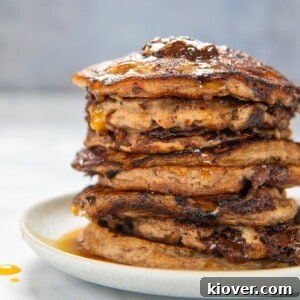 gluten free banana pancakes stacked on a white plate