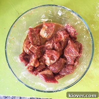 Beef Chow Mein: A Classic Stir-Fry Delight 2 Marinated strip steak strips, ready for stir-frying in Beef Chow Mein.