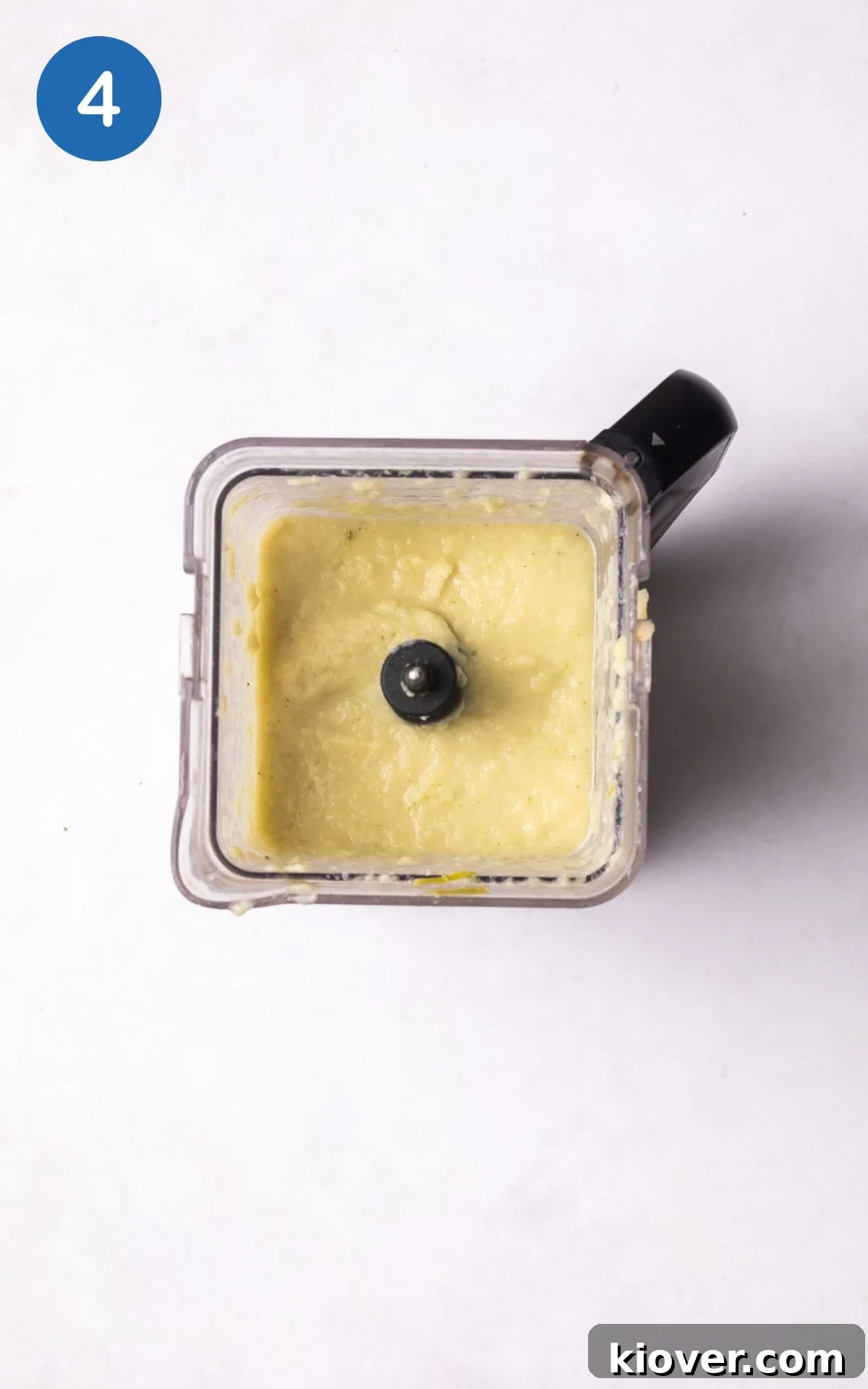 The cooked celeriac soup ingredients are being blended until smooth, indicating the final stage of preparation for the creamy soup.