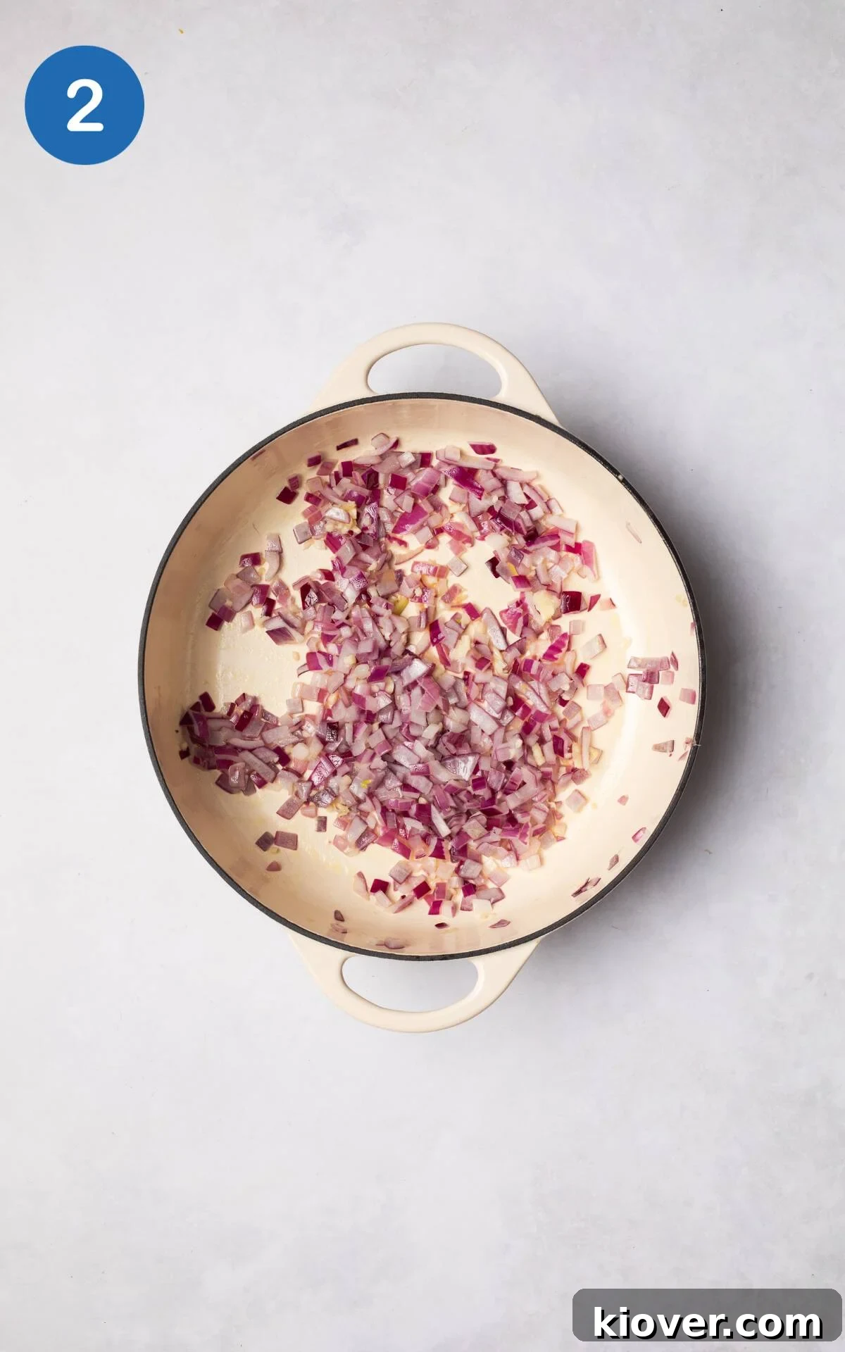 Spiced Vegetable Tagine 5 Diced red onion and crushed garlic sizzling gently in olive oil in a large cooking pot over medium heat.