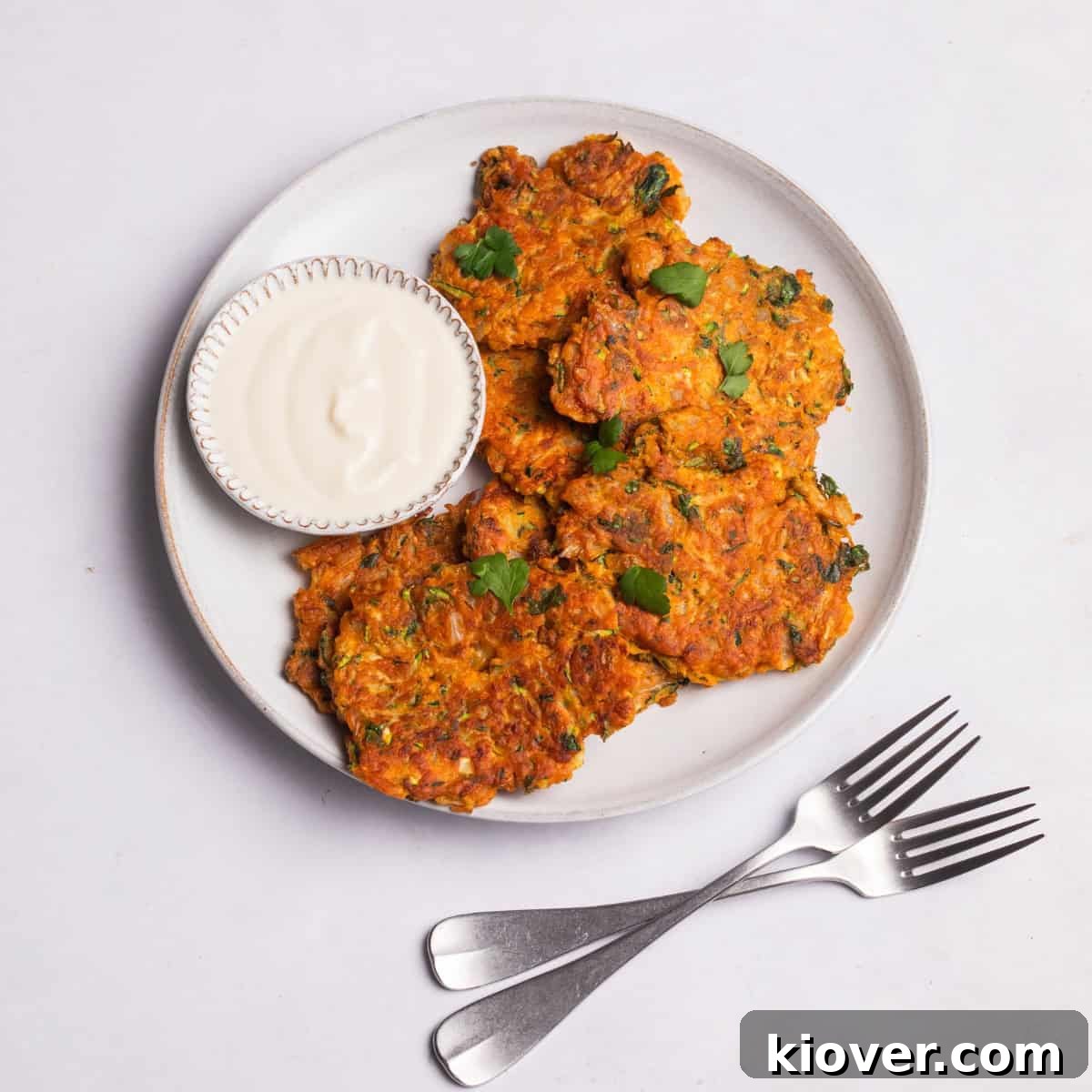 Crispy Zucchini Fritters 2 Crispy vegan courgette fritters served with a dollop of creamy coconut yogurt.