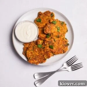 Crispy vegan courgette fritters served with coconut yoghurt for dipping.