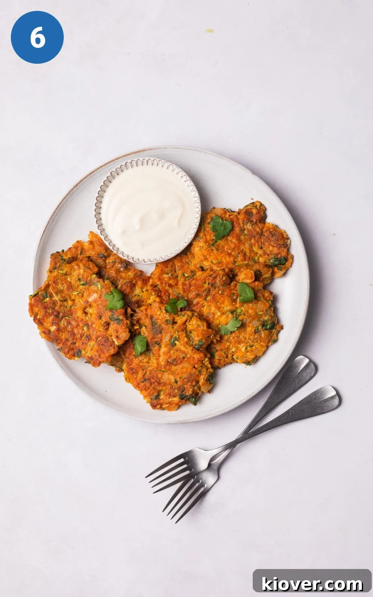 Crispy Zucchini Fritters 9 Golden zucchini fritters served neatly on a plate, ready to be enjoyed.