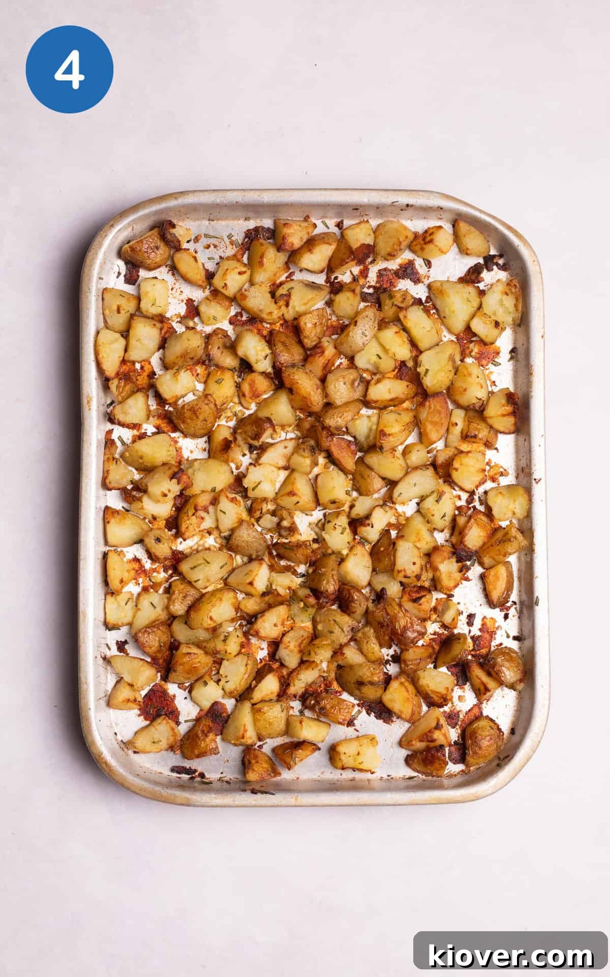 Golden Roasted Potato Cubes 7 Golden Parmentier potatoes combined with crushed garlic, diced rosemary, and salt, ready for final roasting.