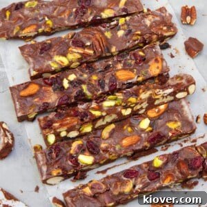 Plant-Based Rocky Road Delights 7 Vegan rocky road in slices on parchment paper.