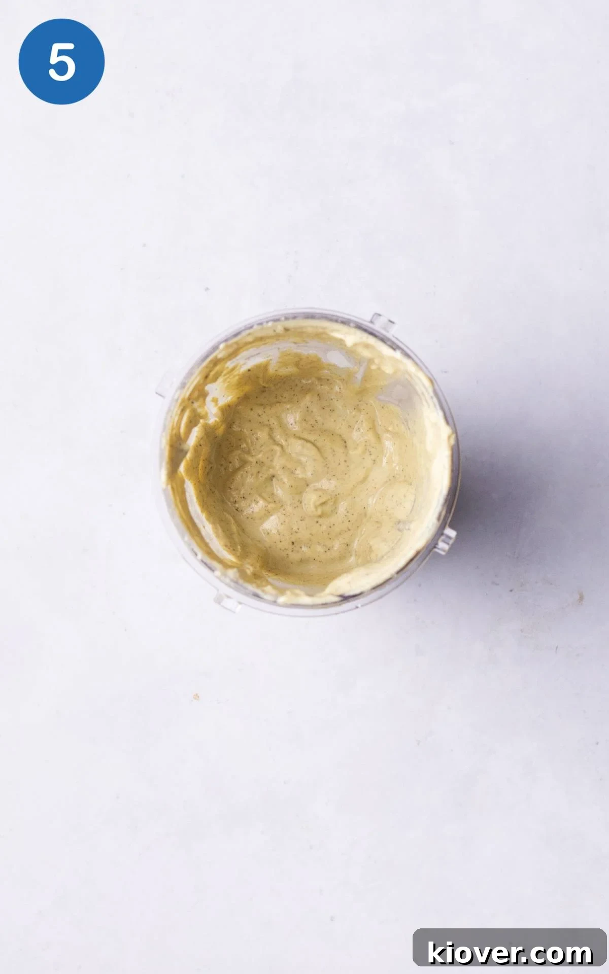 Plant-Based Moussaka Perfection 8 All ingredients for the vegan white sauce, including cashews, nutritional yeast, and plant milk, being blended to a silky smooth consistency.