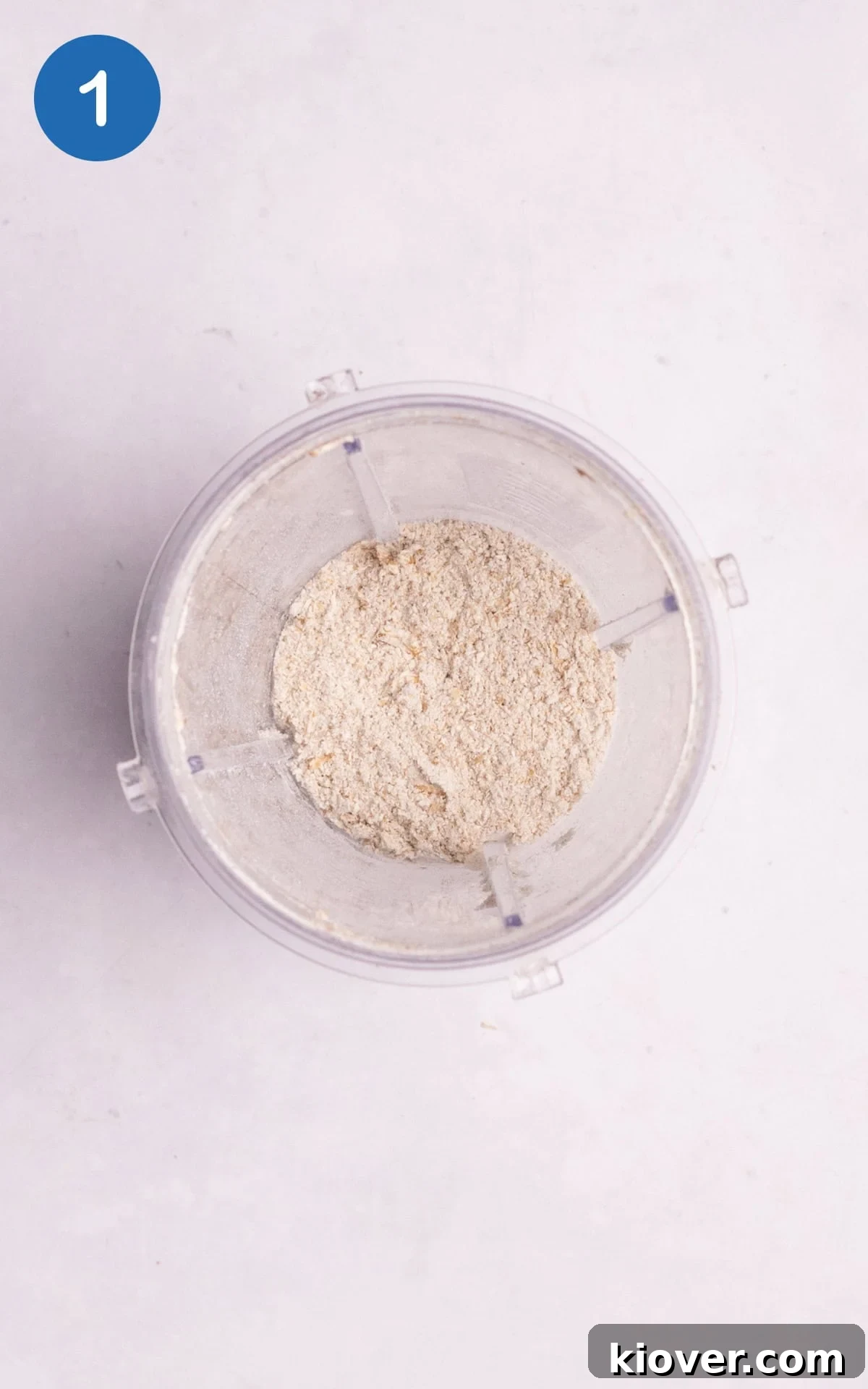 Oats being blended into a fine flour in a blender.