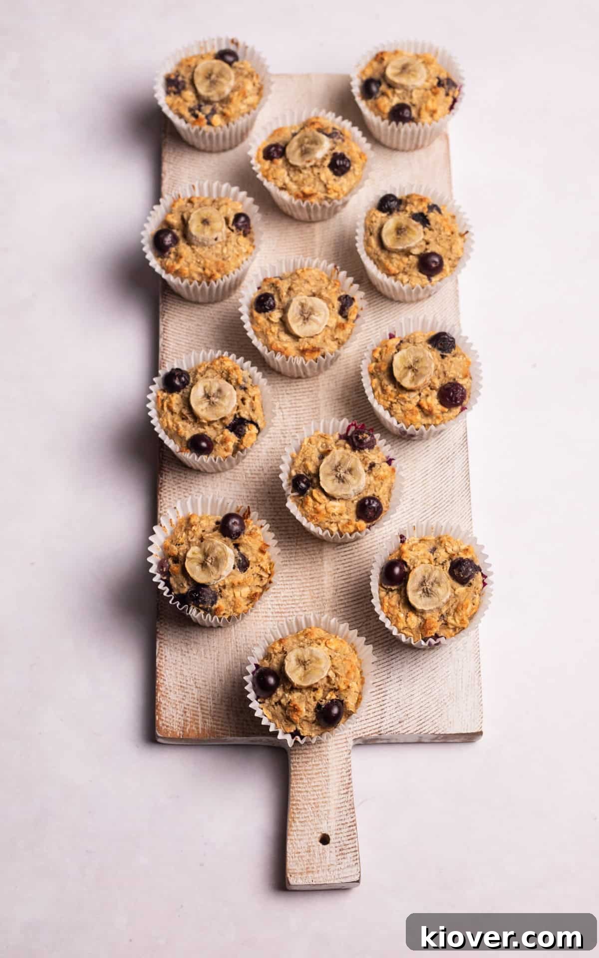 Close-up of perfectly baked Muffins with oatmeal, banana, and blueberries.