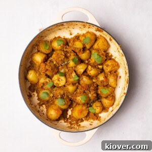 Bombay Aloo (bombay potatoes) garnished with fresh coriander.